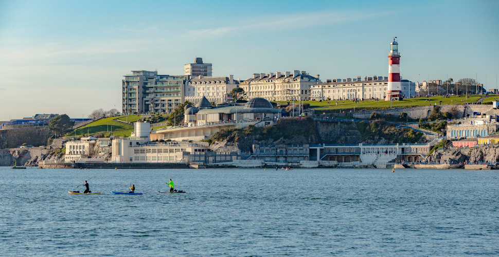 Kayakers on Plymouth Sound National Marine Park with Smeaton's Tower in the background